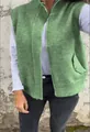 Close-up of the green knitted vest featuring a stand collar and metal front zipper - Green