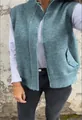 Detail of a casual women's zip-up knitted vest with a stand collar in a teal green finish - Blue