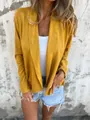 Close-up of casual mustard yellow faux suede open cardigan with soft texture - S / Tops / Yellow