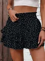 Detail view of women's polka dot tiered ruffle shorts with smocked waist - S / Bottoms / Black Polka Dot Print