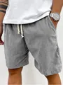 Dettaglio ravvicinato degli eleganti pantaloncini in velluto a coste grigio da uomo - Taglia S / Pantaloni e gonne / Grigio