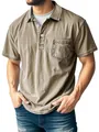 Macro view of men's washed khaki polo shirt with buttoned collar and chest pocket detail - Khaki