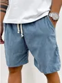Dettaglio ravvicinato dei pantaloncini di velluto a coste blu da uomo con cordoncino - Taglia S / Pantaloni e gonne / Blu