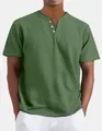 Close-up detail of olive green men's Henley shirt featuring a V-neck and button placket - S / Tops / Green