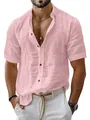 Detailed shot of a pink short-sleeved linen shirt highlighting the fabric texture and buttons - Light Pink