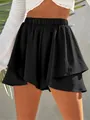 Close-up of black layered women's skort with elastic waist and textured fabric - S / Bottoms / Black