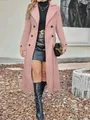 Elegant pink double-breasted long wool coat worn by model in outdoor setting - Pink