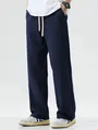Full length view of men's loose navy blue wide-leg casual drawstring sports pants - S / Bottoms / Navy Blue