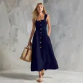 Full-body view of navy blue button-down sleeveless maxi dress with straw bag - S / Elegant Swing Style (1147) / Navy Blue