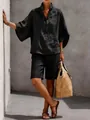 Vista a figura intera di un elegante completo nero in lino a due pezzi per il tempo libero. - Taglia S / Top E Pantaloni / Nero