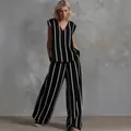 Elegante set due pezzi minimalista francese in lino a righe verticali bianche e nere - Taglia S / Top E Pantaloni / Nero