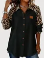 Detailed view of women's black shirt with leopard print patchwork on collar and sleeves - Black