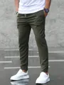 Detail view of men's army green joggers featuring a drawstring waist and tapered fit - S / Bottoms / Army Green