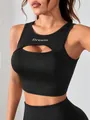 Close-up of black cutout sports crop top with "Dream" letter print - S / Tops / Black