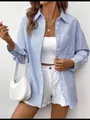 Detailed view of women's blue and white striped long sleeve shirt with classic buttons - Blue (Standard)