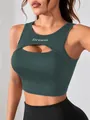 Detail view of green sports tank top with cut-out design and Dream print - S / Tops / Green