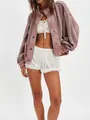 Detailed view of women's pink oversized retro knit cardigan jacket with textured waffle pattern - Pink
