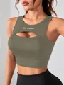 Detailed view of women's olive green sports tank top with chest cut-out and Dream print - Dark Gray