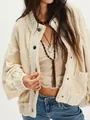 Close-up detail of women's vintage cream chunky knit oversized cardigan with buttons - Apricot