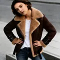 Detail shot of a women's brown suede biker jacket featuring warm tan shearling lining - Brown