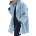 Close-up of the elegant draped shawl collar on a light blue oversized women's wool coat - Sky Blue