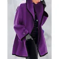 Detailed view of a stylish loose-fit purple wool coat with black contrast edges on a model - S / Tops / Purple
