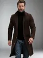 Detail shot of a men's classic dark brown mid-length wool overcoat on a model. - S / Tops / Dark Brown