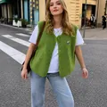 Casual green fleece vest for women featuring single-breasted buttons in a street setting - S / Tops / Green
