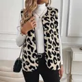Stylish women's leopard print plush vest layered over a white turtleneck sweater. - S / Tops / Leopard Print