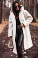 Detailed view of women's long white hooded teddy coat with warm plush texture - S / Tops / Off White