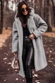 Full-length outdoor shot of a woman wearing a stylish grey plush hooded teddy coat - S / Tops / Silver Gray