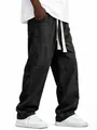 Detailed view of men's loose cotton linen trousers showing drawstring waist and straight fit - S / Bottoms / Black