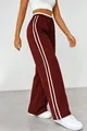 Detailed view of high-waisted burgundy sweatpants with white side stripes and wide legs - S / Bottoms / Dark Red