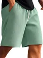 Close-up detail of mint green waffle knit fabric on men's casual shorts - S / Bottoms / Light Green