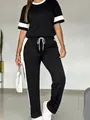 Completo casual donna due pezzi con top a manica corta e pantaloni a righe - Taglia S / Top E Pantaloni / Nero