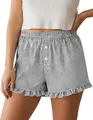 Close-up of womens striped loungewear shorts with ruffle hem and button details. - S / Bottoms / Black