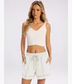 Detail shot of women's white drawstring shorts featuring stylish contrast stitching - S / Bottoms / White