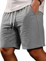 Close-up detail of gray textured men's summer shorts with drawstring waist and pockets - S / Bottoms / Gray