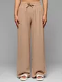 Detail view of high-waisted beige wide-leg trousers with textured fabric and drawstring. - Khaki