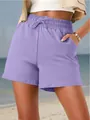 Detail view of purple women's casual shorts featuring elastic waistband and side pocket. - S / Bottoms / Purple