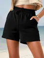 Close-up of black women's casual shorts with drawstring and elastic waist on beach - S / Bottoms / Black