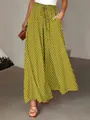 Detail view of bohemian polka dot wide-leg pants featuring high elastic drawstring waist - S / Bottoms / Lemon Yellow