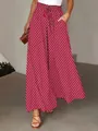 Close-up of the red bohemian wide-leg pants showing the polka dot print and elastic waist - S / Bottoms / Scarlet