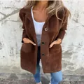 Detail view of a brown fuzzy mid-length coat featuring black buttons and pockets. - S / Tops / Coffee