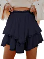 Detailed view of bohemian tiered ruffled mini skirt with lace eyelet trim in navy blue - Navy Blue