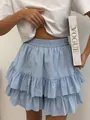 Close-up showing the Swiss dot texture of this light blue high-waisted tiered ruffle skirt. - S / Bottoms / Light Blue
