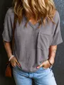 Detailed view of the textured waffle knit fabric and chest pocket on this stylish V-neck top - XS / Tops / Gray