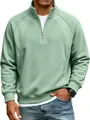 Close-up detail of men's sage green half-zip raglan sleeve sweatshirt with stand collar - Grass Green