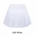 Front view of a white pleated children's sports tennis skort with functional athletic fabric - M / Bottoms / White