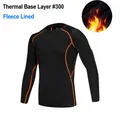 Men's black fleece-lined long sleeve compression shirt with orange stitching for training - S / Tops / Fleece Lined / Black Orange Floral